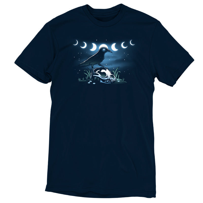 Premium Cotton T-shirt_TeeTurtle Mystical Crow navy blue t-shirt featuring a crow with glowing eyes standing on an animal skull in a grassy area under a night sky.