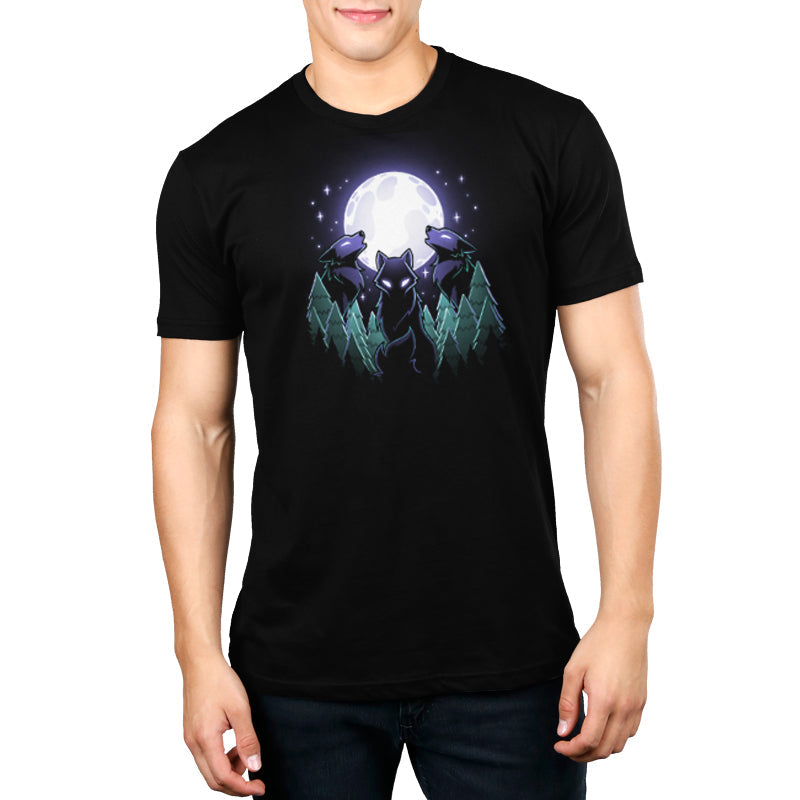 Premium Cotton T-shirt_TeeTurtle Mystical Moon black t-shirt featuring three wolves with glowing eyes howl at a large, Mystical Moon, surrounded by a nature forest of evergreen trees and twinkling stars in the night sky.