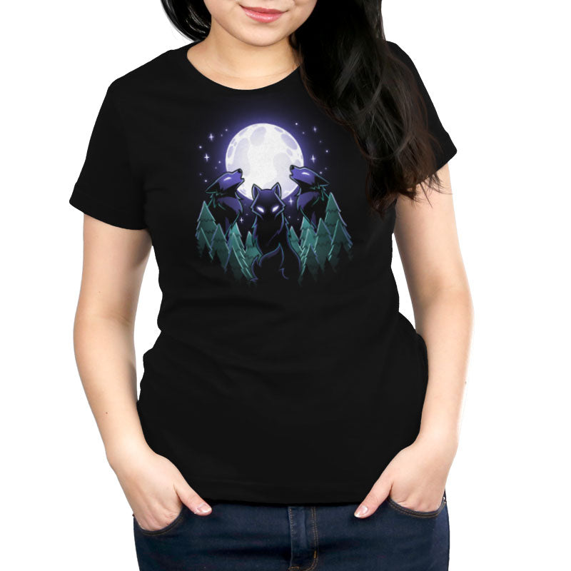 Premium Cotton T-shirt_TeeTurtle Mystical Moon black t-shirt featuring three wolves with glowing eyes howl at a large, Mystical Moon, surrounded by a nature forest of evergreen trees and twinkling stars in the night sky.