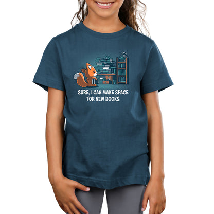 Premium Cotton T-shirt - A young girl wearing a dark blue unisex apparelwith a cartoon fox and a quote about making space for new Never-Ending Bookshelf books printed on the front by monsterdigital.