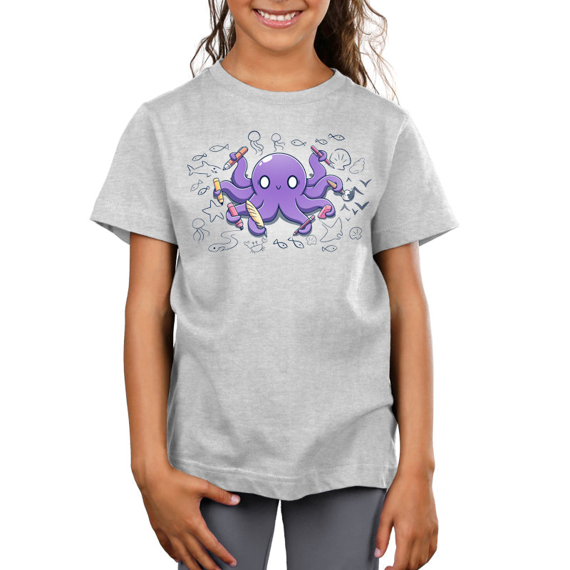 Premium Cotton T-shirt_TeeTurtle Octopus Artist silver gray t-shirt featuring an illustration of a cheerful purple octopus holding various creative tools, surrounded by sketches of sea creatures and nautical elements.