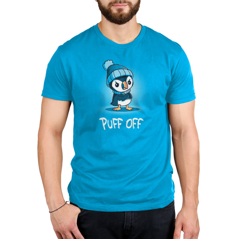 Premium Cotton T-shirt_TeeTurtle Puff Off cobalt blue t-shirt featuring a grumpy puffin wearing a hat and scarf with a pun underneath.