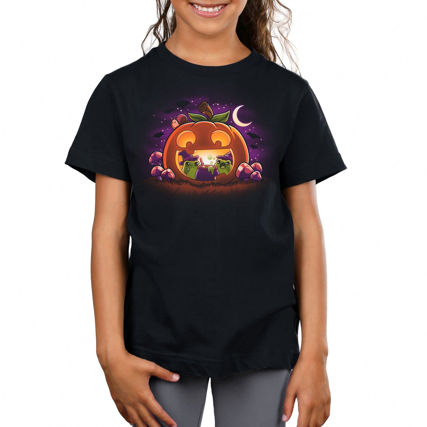 Premium Cotton T-shirt_TeeTurtle Pumpkin Frog Witches black t-shirt featuring two frogs wearing witch hats brewing a cauldron of potion inside of a happy Halloween jack-o-lantern.