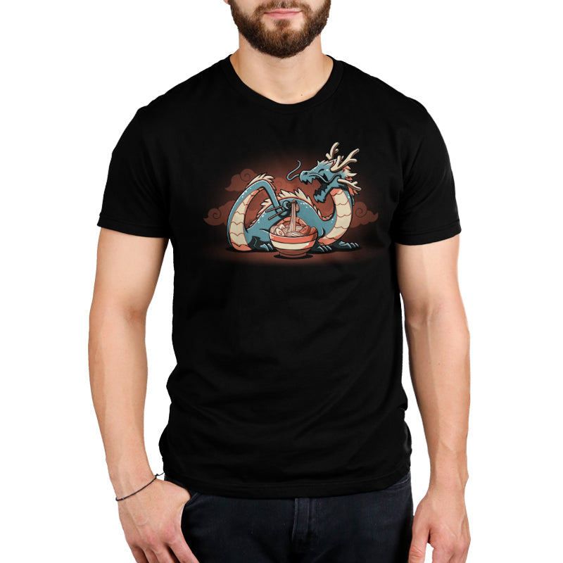 Premium Cotton T-shirt_TeeTurtle Ramen Dragon black t-shirt featuring a food loving dragon with chopsticks who eats noodles from a bowl, set against a dark background with swirling clouds.