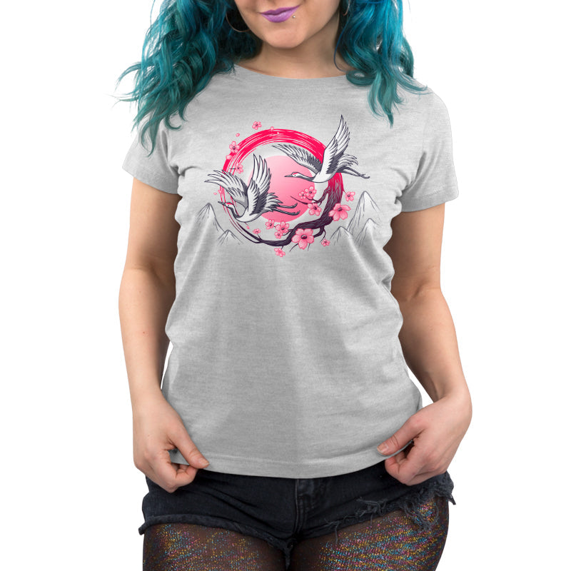 Premium Cotton T-shirt_TeeTurtle Red-Crowned Cranes silver gray t-shirt featuring an illustration of two cranes in flight with pink sakura blossoms, a red circular element, and stylized mountains in the background. 