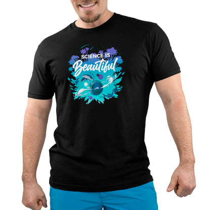 Premium Cotton T-shirt_TeeTurtle Science Is Beautiful black t-shirt featuring the phrase "Science is Beautiful," with images of whales, planets, and tropical trees surrounding Earth in a splash of vibrant blues and greens.