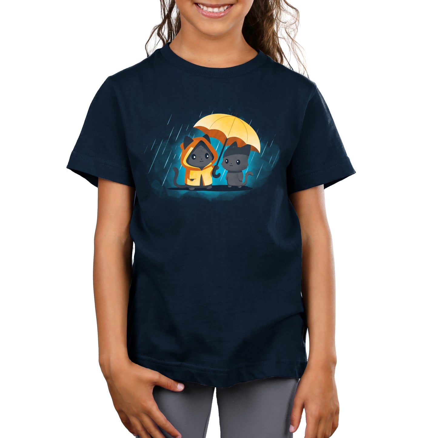 Premium Cotton T-shirt - Child wearing a navy blue unisex apparelmade from 100% super soft ringspun cotton, featuring a graphic of two cartoon puppies under a yellow umbrella in the rain, named "Sharing Kindness" by monsterdigital.