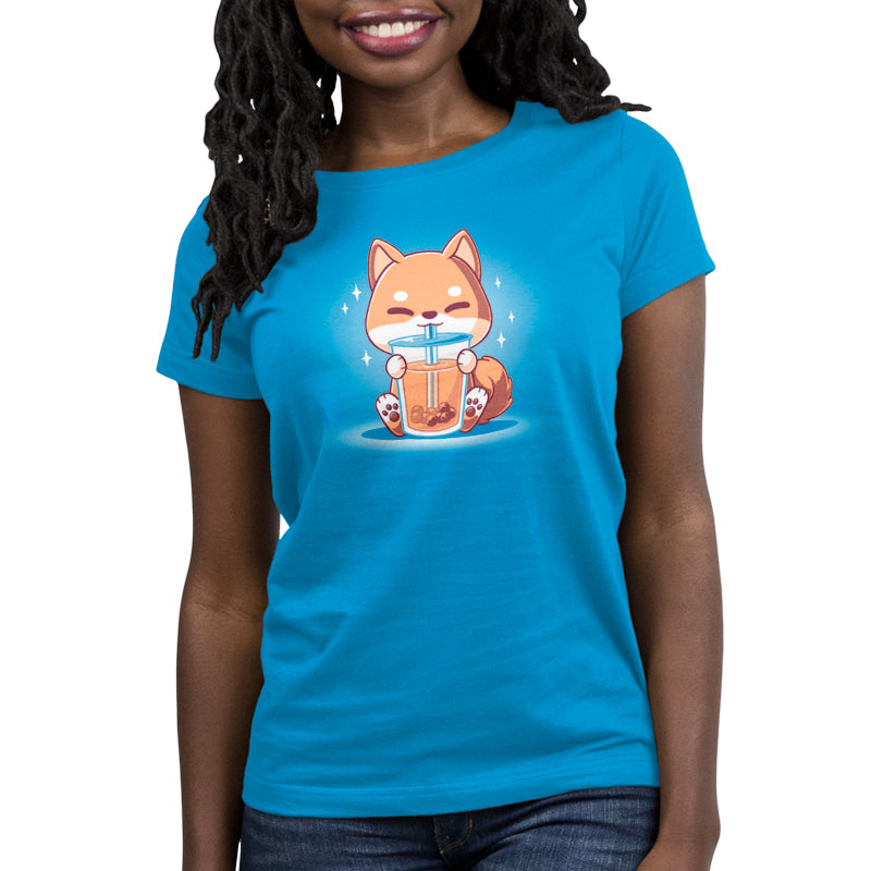 Premium Cotton T-shirt_TeeTurtle Boba Shiba Cobalt Blue t-shirt featuring a cartoon fox happily drinking Boba Shiba from a cup with a straw, set against a blue background with sparkles.