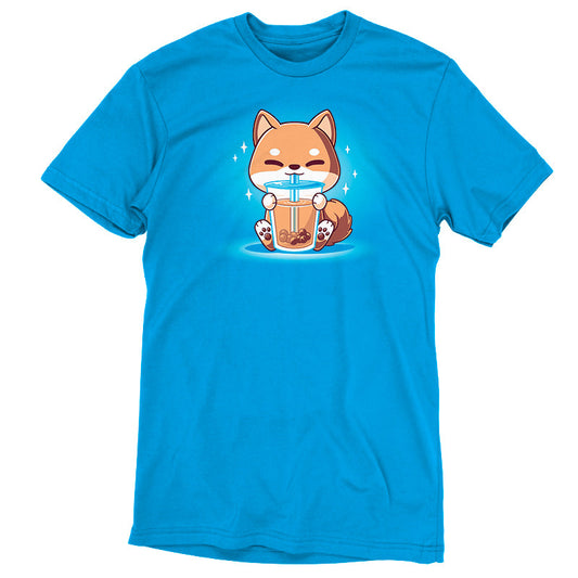 Premium Cotton T-shirt_TeeTurtle Boba Shiba Cobalt Blue t-shirt featuring a cartoon fox happily drinking Boba Shiba from a cup with a straw, set against a blue background with sparkles.