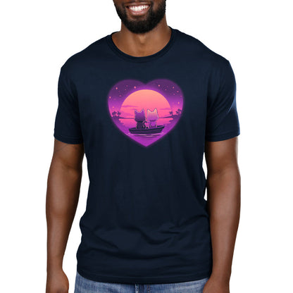 Premium Cotton T-shirt_TeeTurtle Sunset Romance navy blue t-shirt featuring two cats sitting in a boat on calm water, gazing at a colorful sunset framed by a heart shape, with a starry sky and palm trees in the background.