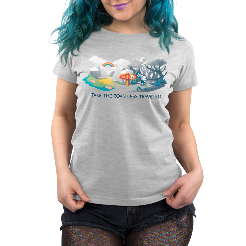 Premium Cotton T-shirt_TeeTurtle The Road Less Traveled silver gray t-shirt featuring an illustration of a rabbit at a crossroads, one path leading to a vibrant, colorful landscape under a rainbow, and the other to a dark forest; text below reads "TAKE THE ROAD LESS TRAVELED." 