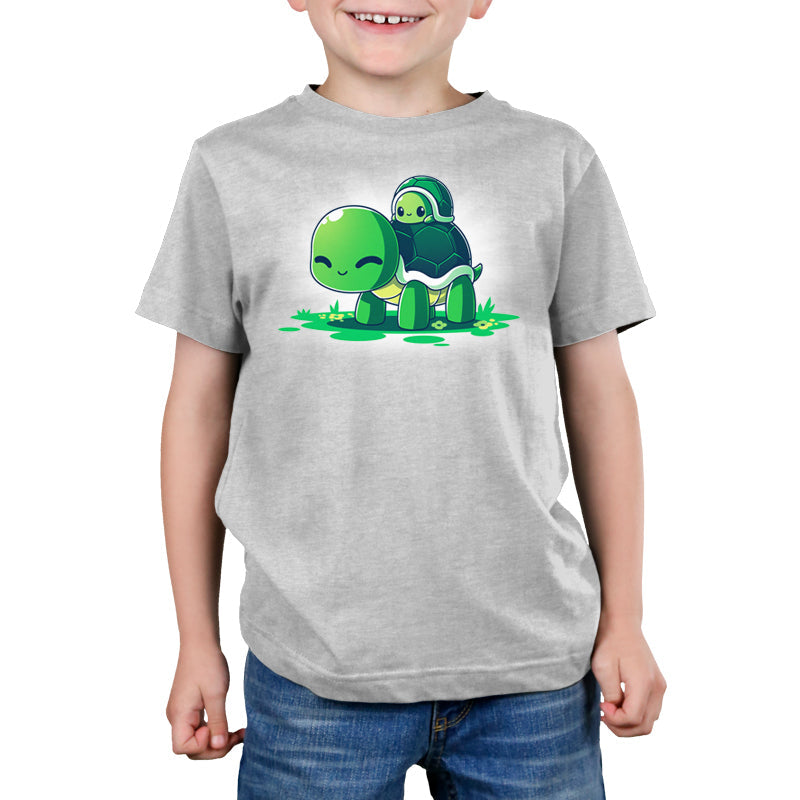 Premium Cotton T-shirt_TeeTurtle Turtleback Ride silver gray t-shirt featuring two smiling green turtles on top of grass and yellow flowers. The smaller turtle is on top of the larger turtle's shell. 