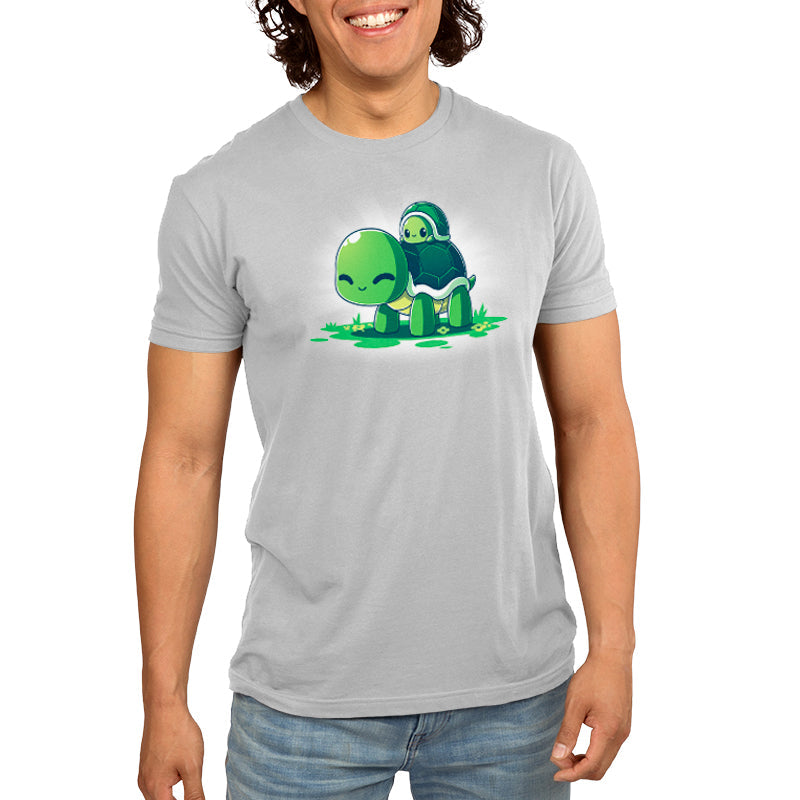 Premium Cotton T-shirt_TeeTurtle Turtleback Ride silver gray t-shirt featuring two smiling green turtles on top of grass and yellow flowers. The smaller turtle is on top of the larger turtle's shell. 