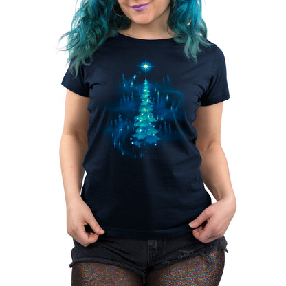 Premium Cotton T-shirt_TeeTurtle Twinkling Christmas Tree navy blue t-shirt featuring an artistic christmas tree with white sparkly lights surrounded by silhouettes of other trees and a star on top.