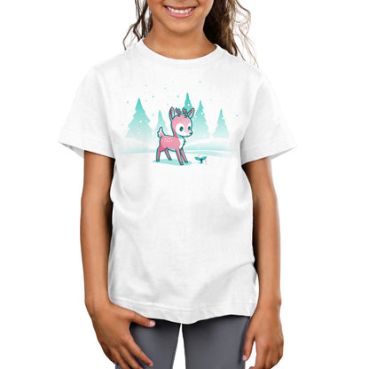 Premium Cotton T-shirt_TeeTurtle Winter Wonderland White t-shirt featuring a cartoon deer with small antlers stands in a snowy landscape with evergreen trees, looking curiously at a glowing sprout on the ground. Snowflakes are falling around them. 