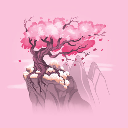 Premium Cotton T-shirt_TeeTurtle Sakura Tree pink t-shirt featuring an illustration of a pink cherry blossom tree on a rocky cliff with mountains in the background. Blossoms and petals are being blown in the wind. 