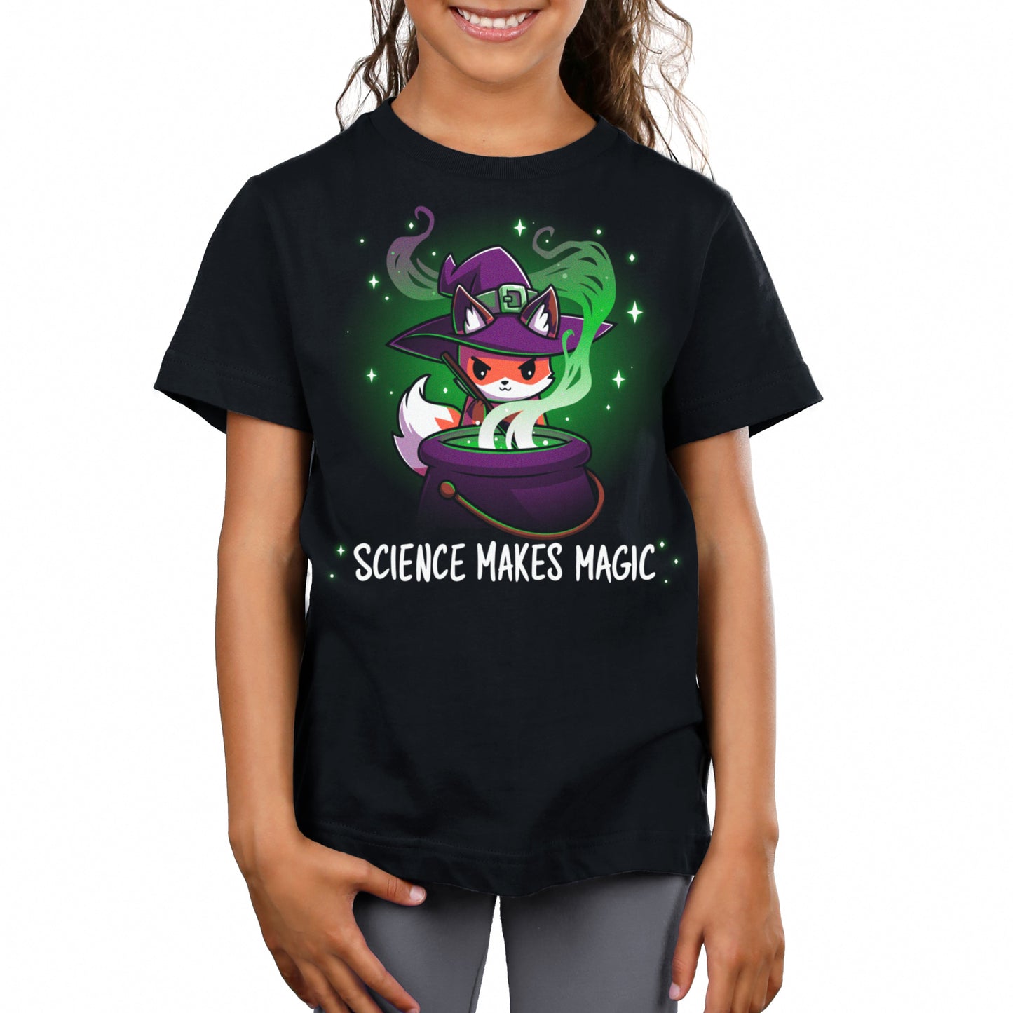 Premium Cotton T-shirt_TeeTurtle Science Makes Magic black t-shirt featuring a fantasy fox wearing a purple witch hat, stirring a cauldron with green smoke and sparkles rising. Text below reads, "SCIENCE MAKES MAGIC."