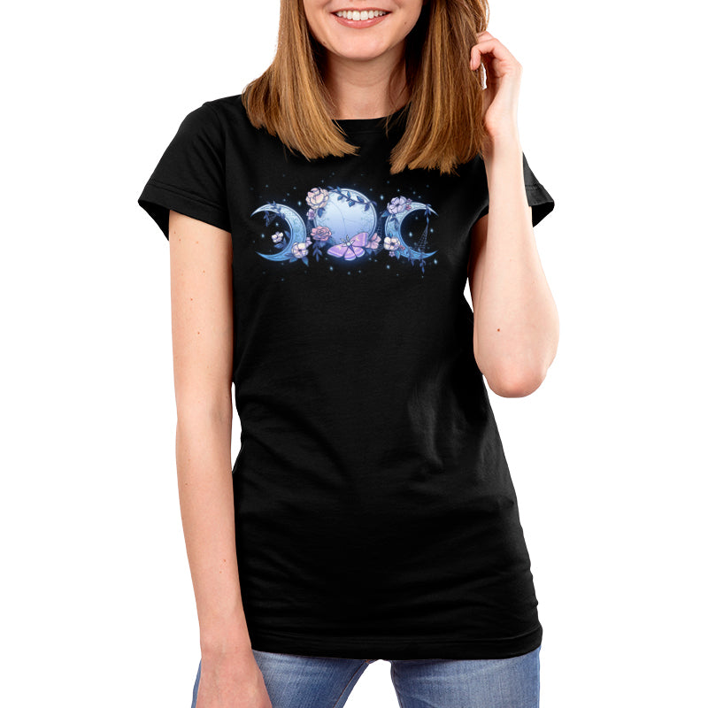 Premium Cotton T-shirt_TeeTurtle black Enchanted Moons featuring a full moon surrounded by crescent moons on each side with flowers, cobwebs, and a moth.