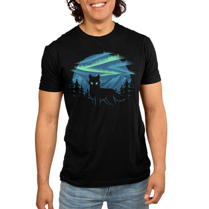 Premium Cotton T-shirt_A black apparel features a silhouette of a wolf with glowing eyes standing in front of a forest and mountains, with the wild aurora illuminating the night sky in the background. Made of super soft ringspun cotton, this Wild Aurora by monsterdigital is both comfortable and striking.