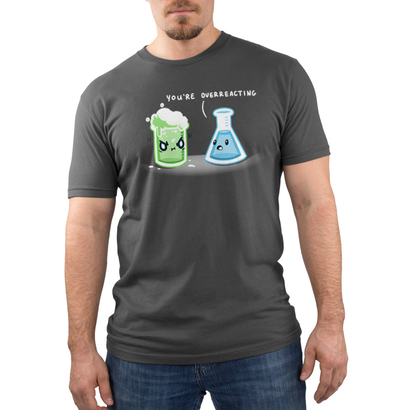 Premium Cotton T-shirt You're Overreacting charcoal gray t-shirt featuring a green beaker with an angry expression and foam spilling out, and a blue conical flask with a calm expression.
