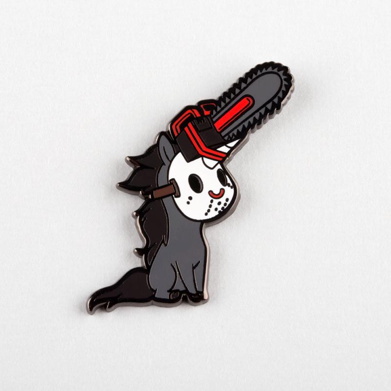 A scariest night-MARE Chainsaw Unicorn Pin, featuring a cat holding a chainsaw from TeeTurtle.