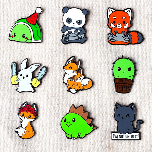 A collection of TeeTurtle's Dia de los Foxes Pins featuring various animals.