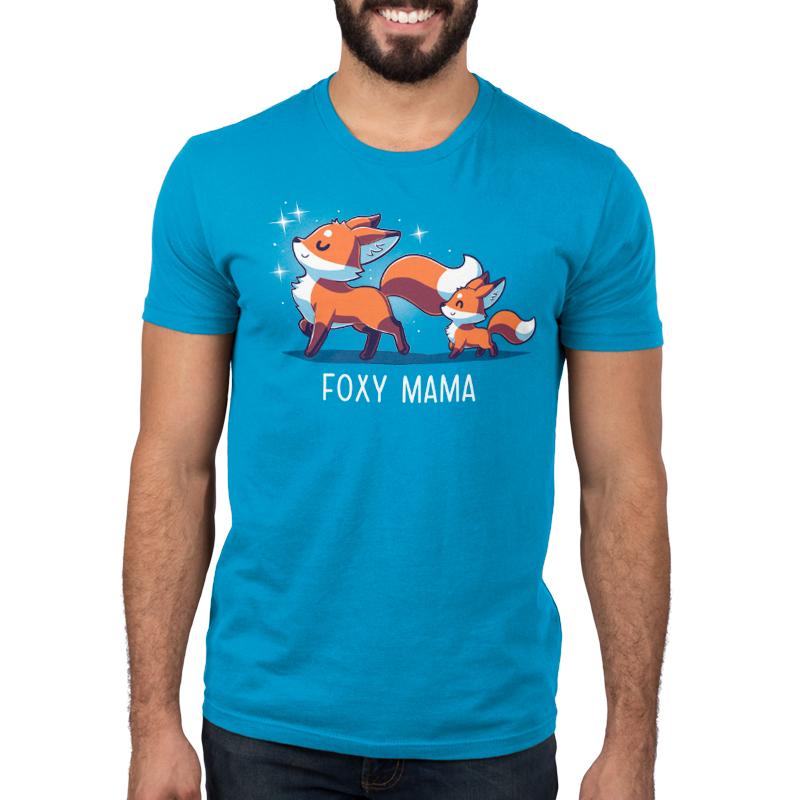 Premium Cotton T-shirt_TeeTurtle Foxy Mama cobalt blue t-shirt featuring a proud, smiling fox walking ahead with a smaller fox following.