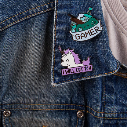 A TeeTurtle Gamer Pin on a denim jacket.