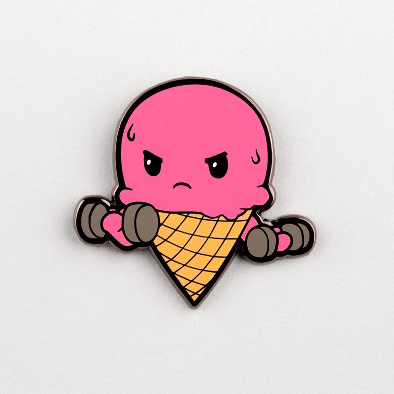 A TeeTurtle "I Do It For The Ice Cream Pin" with dumbbells on it.