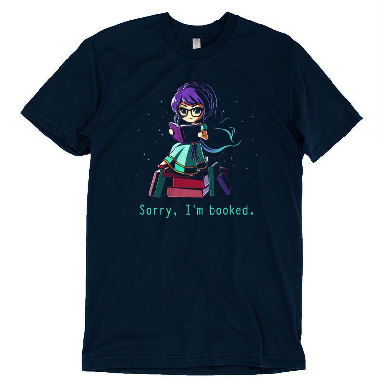 Premium Cotton T-shirt_TeeTurtle navy blue Sorry I'm Booked]. Featuring a girl sitting on a pile of books reading.