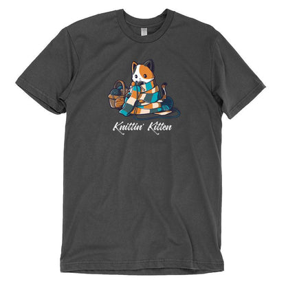 Premium Cotton T-shirt_TeeTurtle Knittin' Kitten charcoal gray t-shirt featuring a calico cat knitting a long scarf that’s wrapped around it with a basket of yarn next to it.