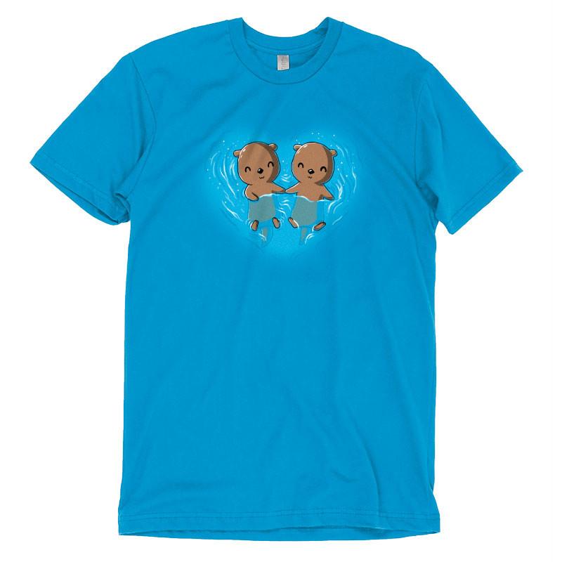 Premium Cotton T-shirt_Teeturtle My Otter Half cobalt blue t-shirt featuring two otters holding hands while floating on their backs in water, surrounded by ripples in a heart shape.