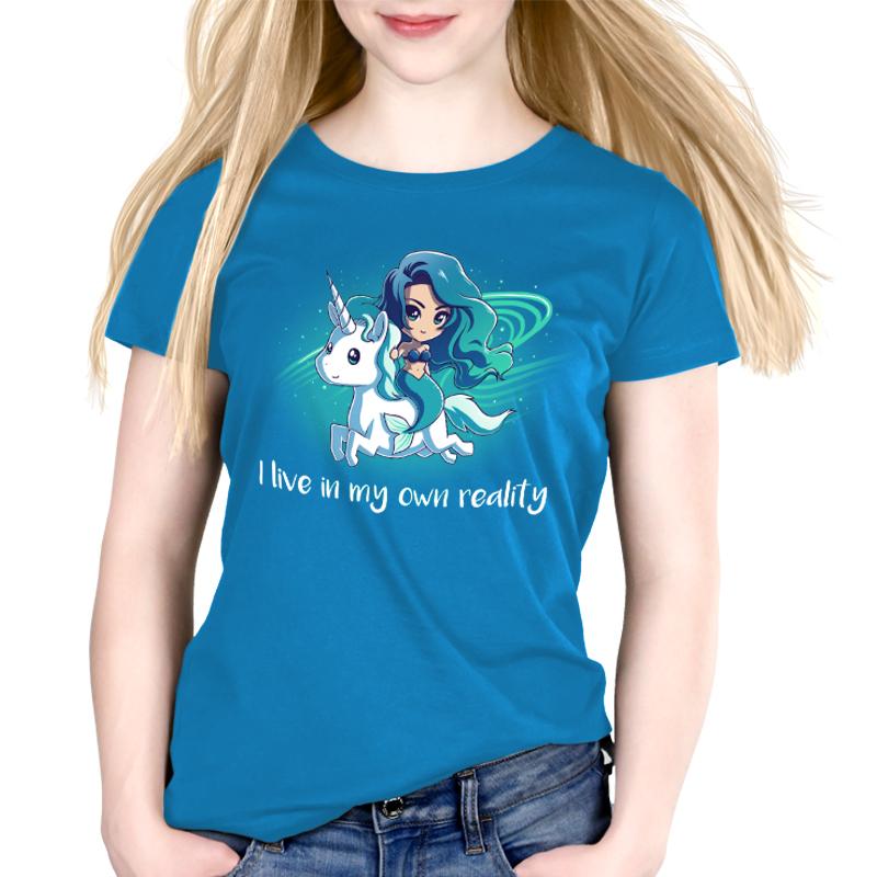 Premium Cotton T-shirt_TeeTurtle cobalt blue My Reality. Featuring a blue-haired mermaid riding a white unicorn.