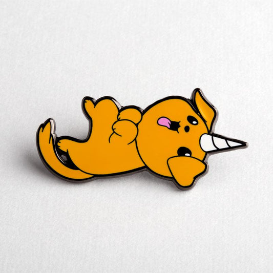 An orange cat with a TeeTurtle Puppicorn Pin enamel pin.