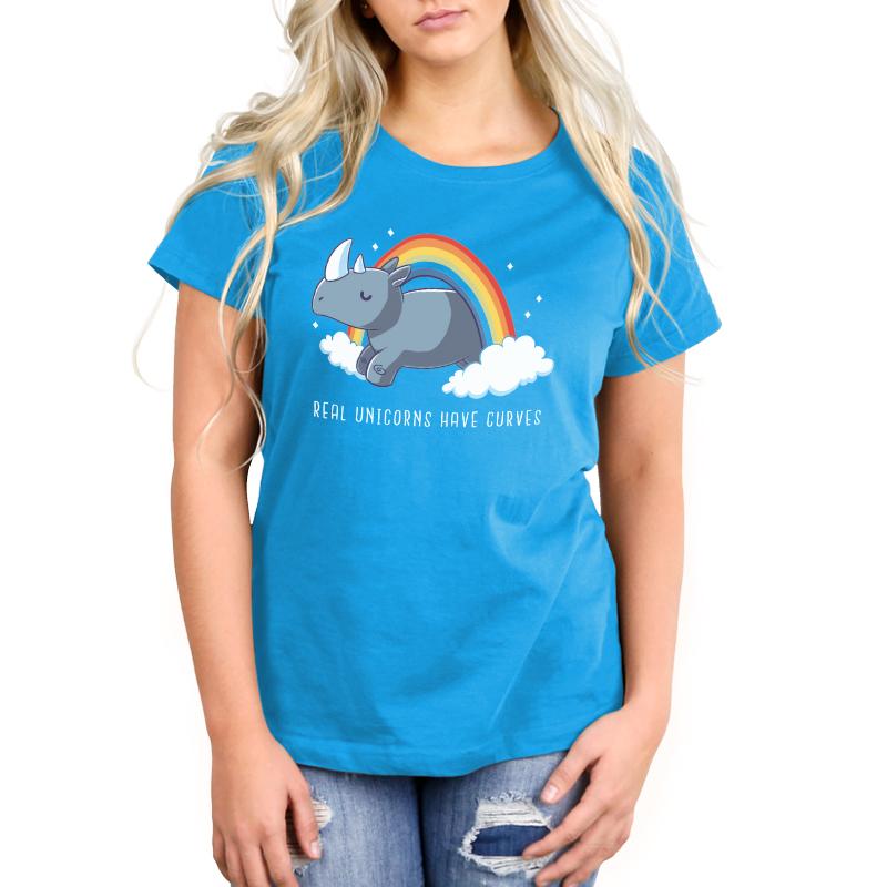 Premium Cotton T-shirt_TeeTurtle cobalt blue Real Unicorns Have Curves. Featuring a rhinoceros jumping through a rainbow arc.