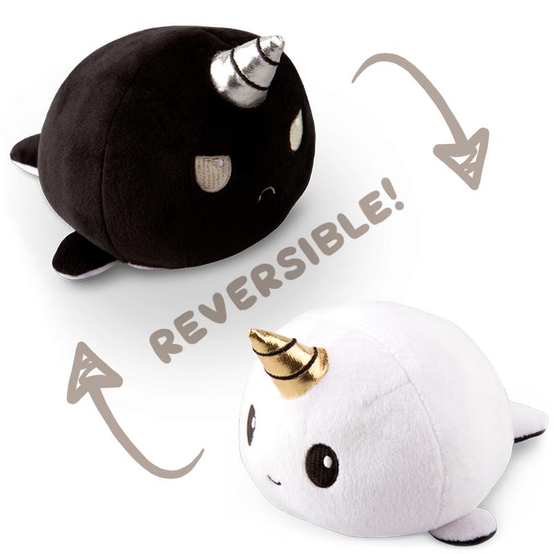 A TeeTurtle Reversible Narwhal Plushie in black and white.